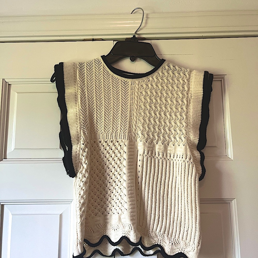 Elegant Cream Sweater with Black Trim